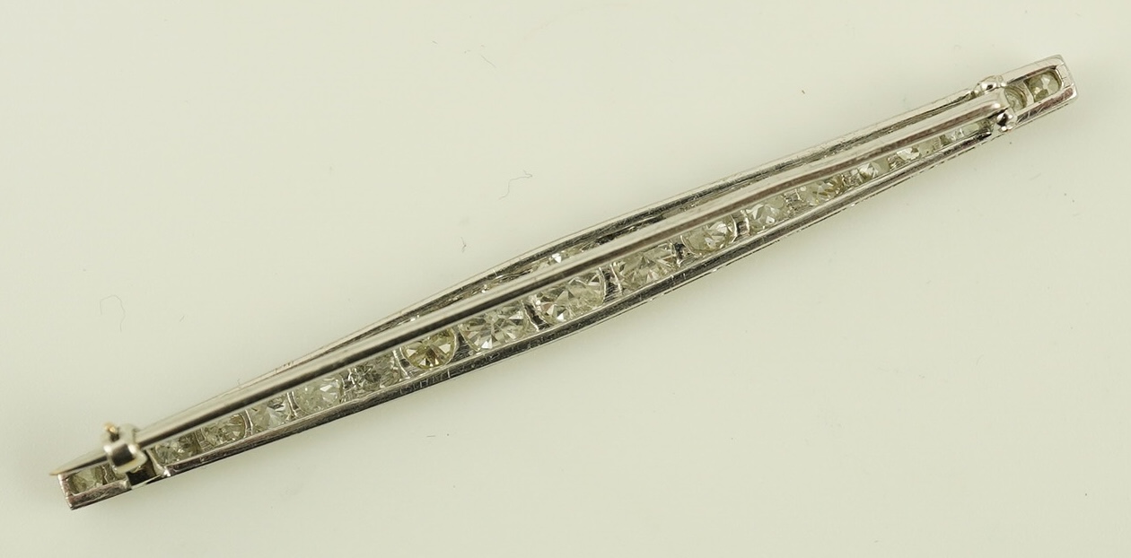 A 1920's platinum? and nineteen millegrain set graduated diamond bar brooch